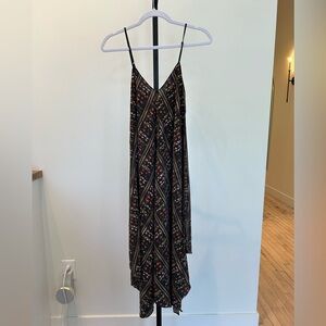 Stand out this summer is this Geometric Hankerchief Midi Dress